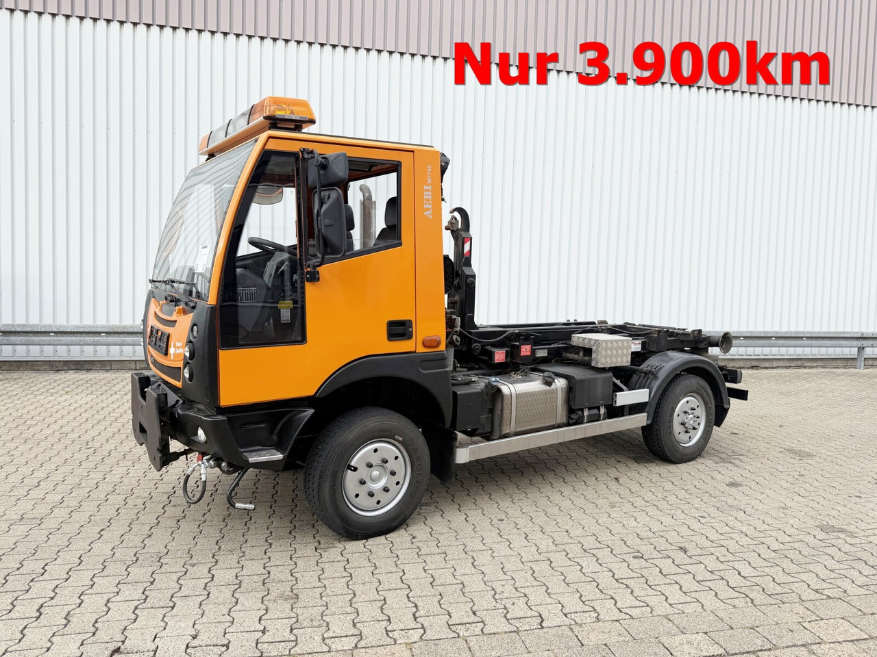 AEBI Schmidt MT750 4x4 AEBI Schmidt MT750 4x4, City-Abroller, Winterdienstausstattung, 2x AHK - 후크 리프트 트럭 : 사진 1 AEBI Schmidt MT750 4x4 AEBI Schmidt MT750 4x4, City-Abroller, Winterdienstausstattung, 2x AHK - 후크 리프트 트럭 : 사진 1