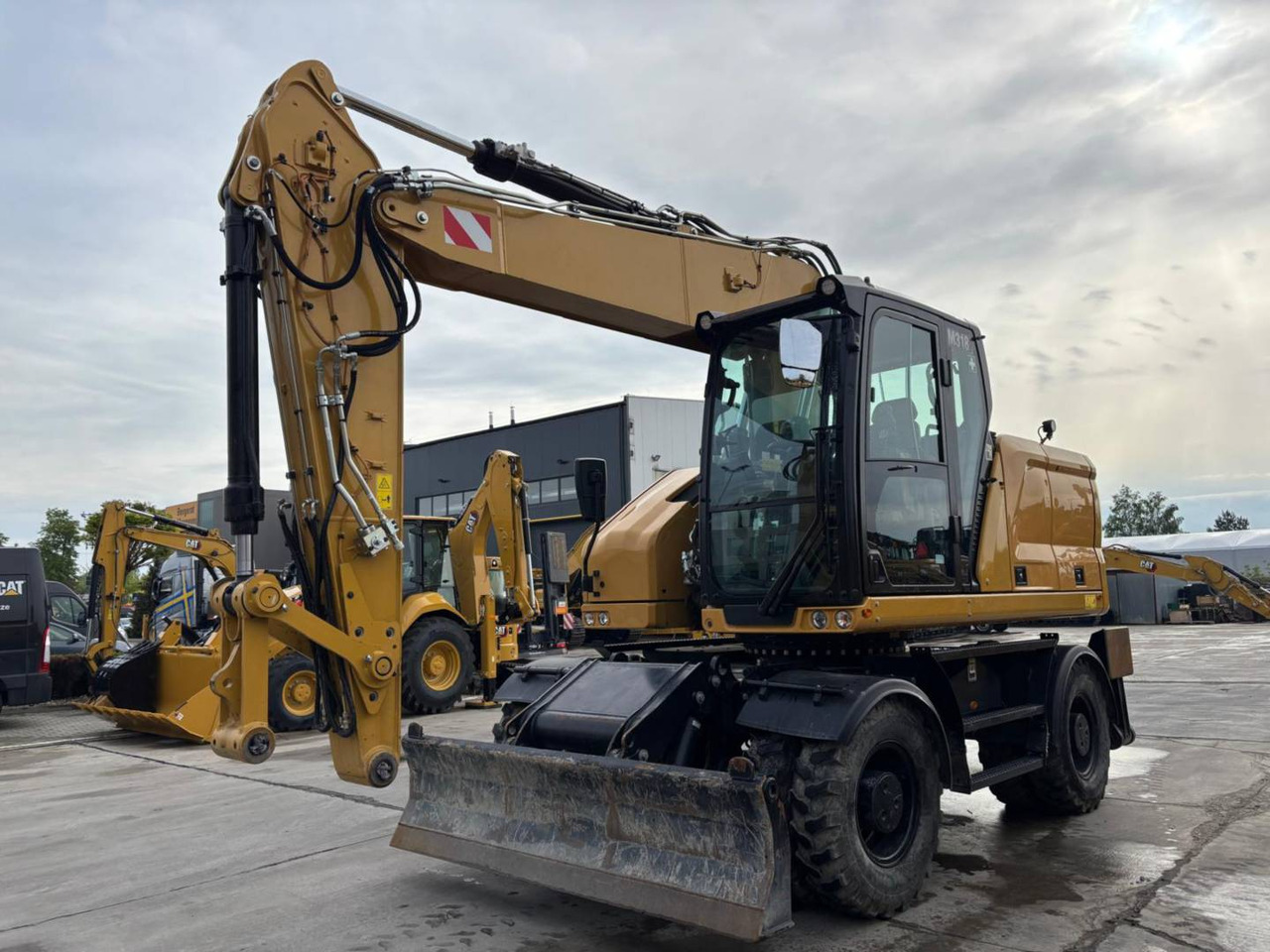 CAT M318 - 휠 굴삭기 : 사진 1 CAT M318 - 휠 굴삭기 : 사진 1