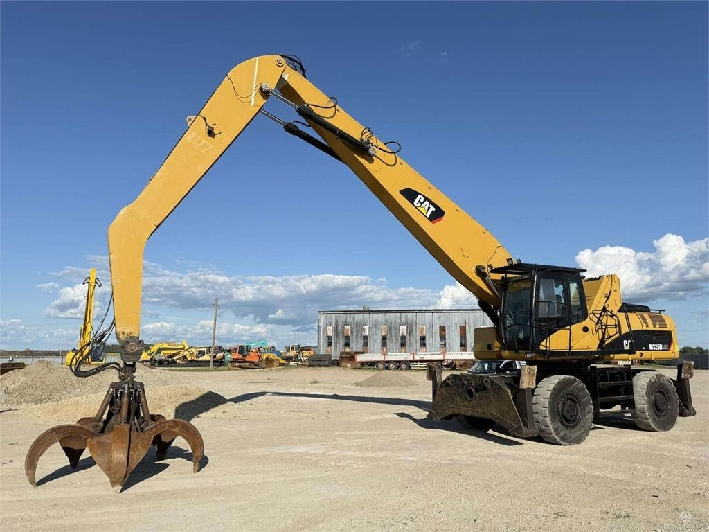 CAT M 325 DLMH - 휠 굴삭기 : 사진 1 CAT M 325 DLMH - 휠 굴삭기 : 사진 1