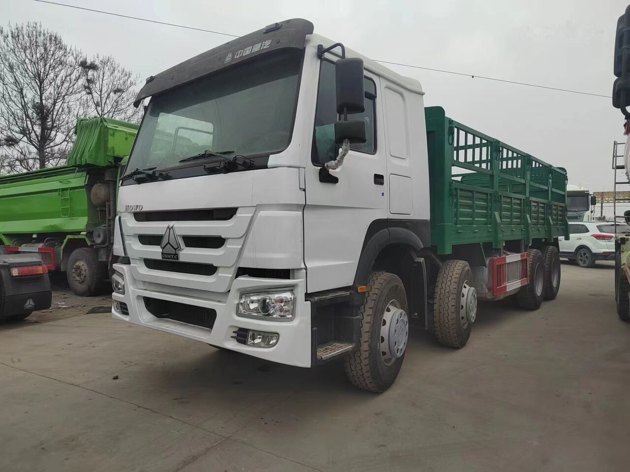 Sinotruk HOWO 8*4 Fence Truck - 드롭사이드/ 플랫베드 트럭 : 사진 1 Sinotruk HOWO 8*4 Fence Truck - 드롭사이드/ 플랫베드 트럭 : 사진 1