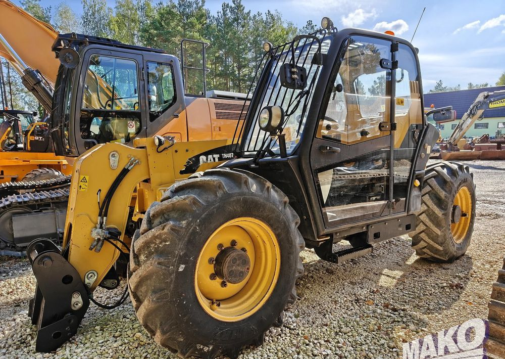 Caterpillar TH407 - 텔레스코픽 핸들러 : 사진 1 Caterpillar TH407 - 텔레스코픽 핸들러 : 사진 1