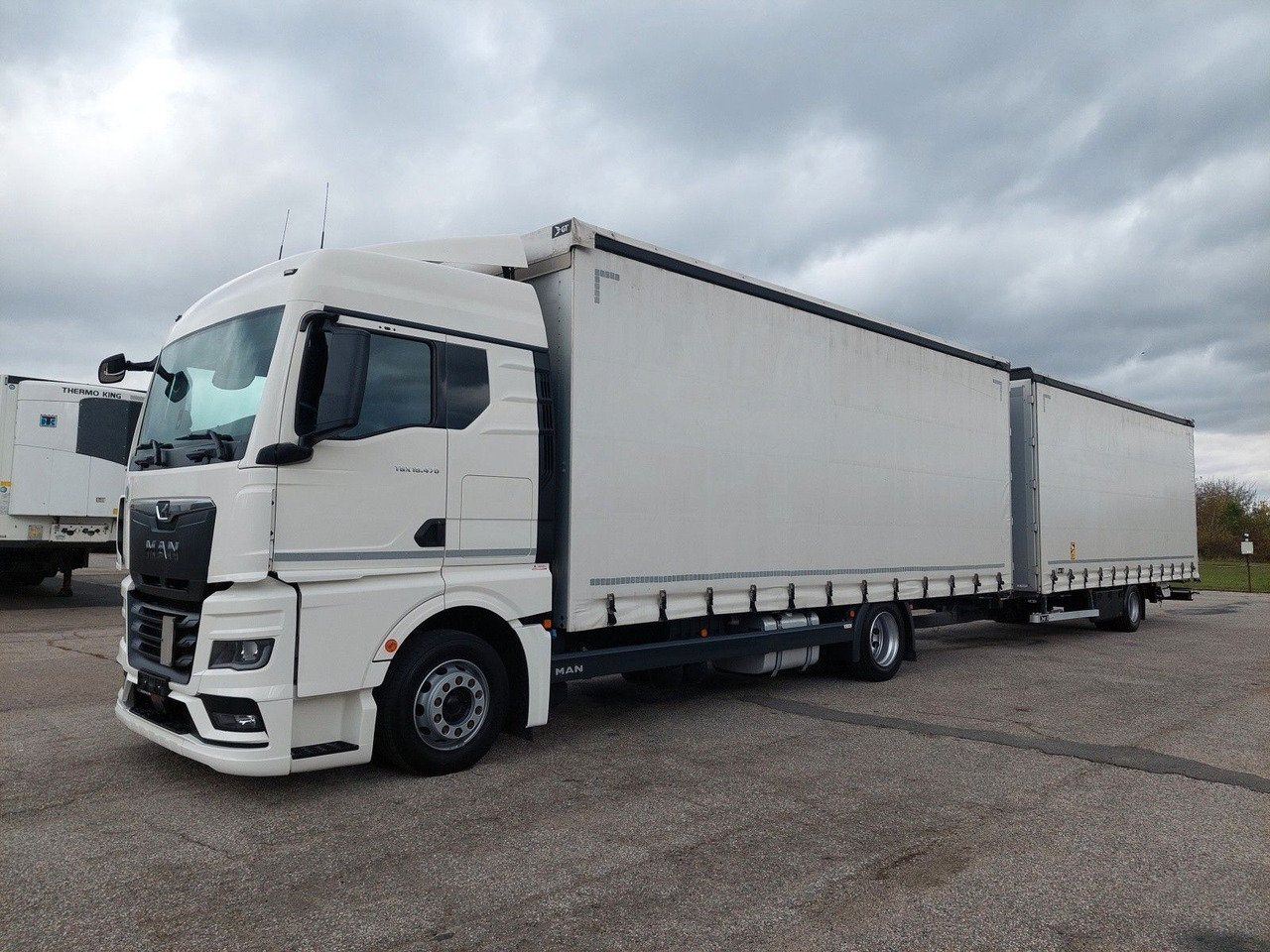MAN TGX 18.470 LL + Gniotpol G-4080 120 m3 Durchbar - 커튼사이더 트럭 : 사진 1 MAN TGX 18.470 LL + Gniotpol G-4080 120 m3 Durchbar - 커튼사이더 트럭 : 사진 1