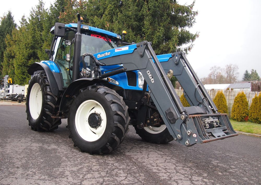 Ciągnik New Holland NH TS125A 6 cylindrów 2004 Ciągnik rolniczy New Holland TS125A - 장궤형 트랙터 : 사진 2 Ciągnik New Holland NH TS125A 6 cylindrów 2004 Ciągnik rolniczy New Holland TS125A - 장궤형 트랙터 : 사진 2