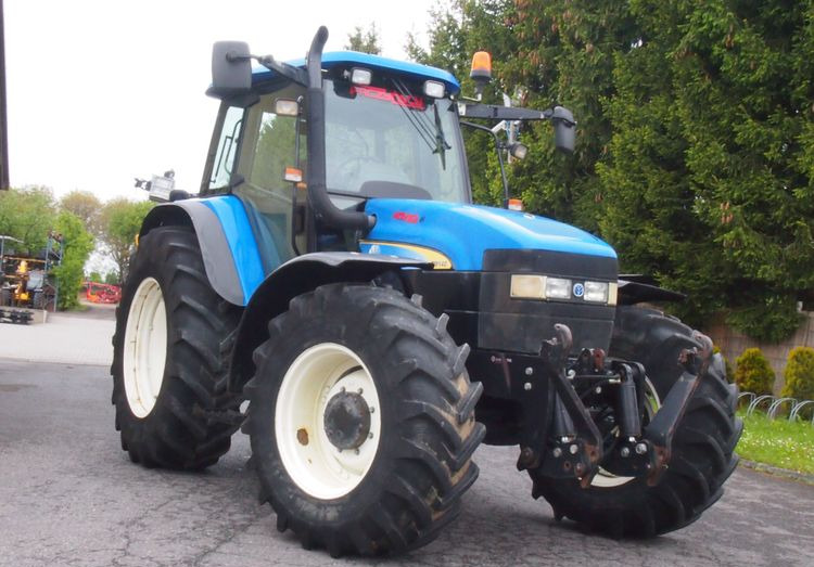Ciągnik New Holland TM 140 2004 Przedni TUZ - 장궤형 트랙터 : 사진 2 Ciągnik New Holland TM 140 2004 Przedni TUZ - 장궤형 트랙터 : 사진 2
