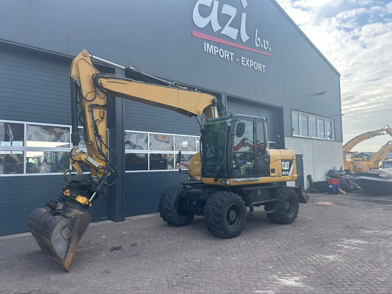 Caterpillar M313D - 휠 굴삭기 : 사진 1 Caterpillar M313D - 휠 굴삭기 : 사진 1