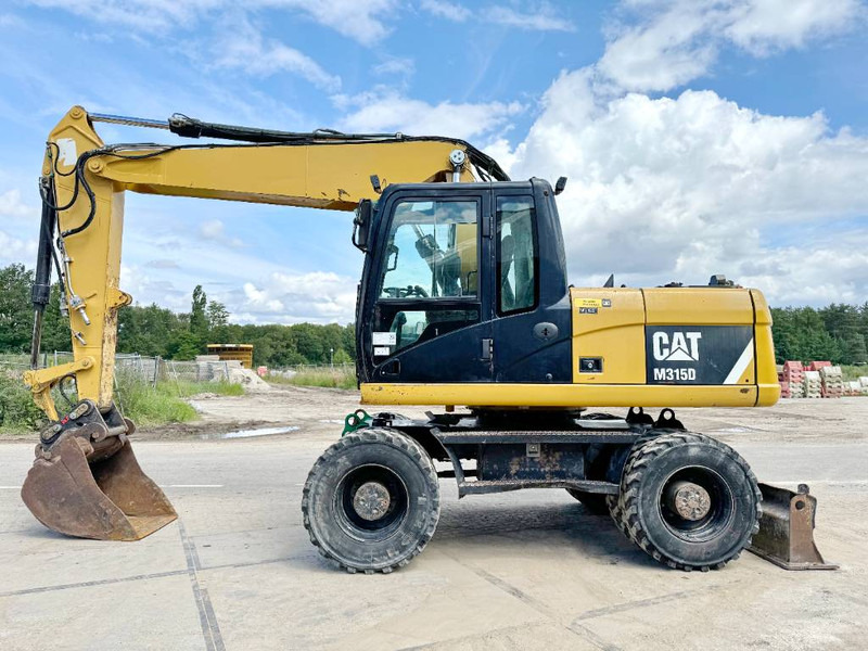 Cat M315D - Triple Boom / Quick Coupler - 휠 굴삭기 : 사진 1 Cat M315D - Triple Boom / Quick Coupler - 휠 굴삭기 : 사진 1