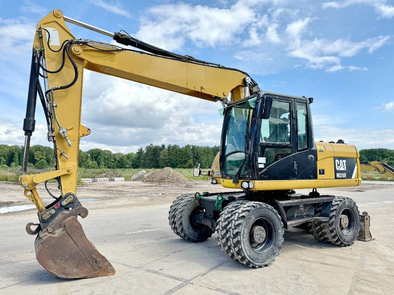 Cat M315D - Triple Boom / Quick Coupler - 휠 굴삭기 : 사진 2 Cat M315D - Triple Boom / Quick Coupler - 휠 굴삭기 : 사진 2