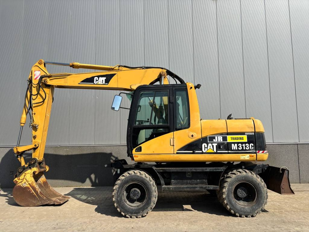 CAT M 313 C (Low verified hours) - 휠 굴삭기 : 사진 1 CAT M 313 C (Low verified hours) - 휠 굴삭기 : 사진 1