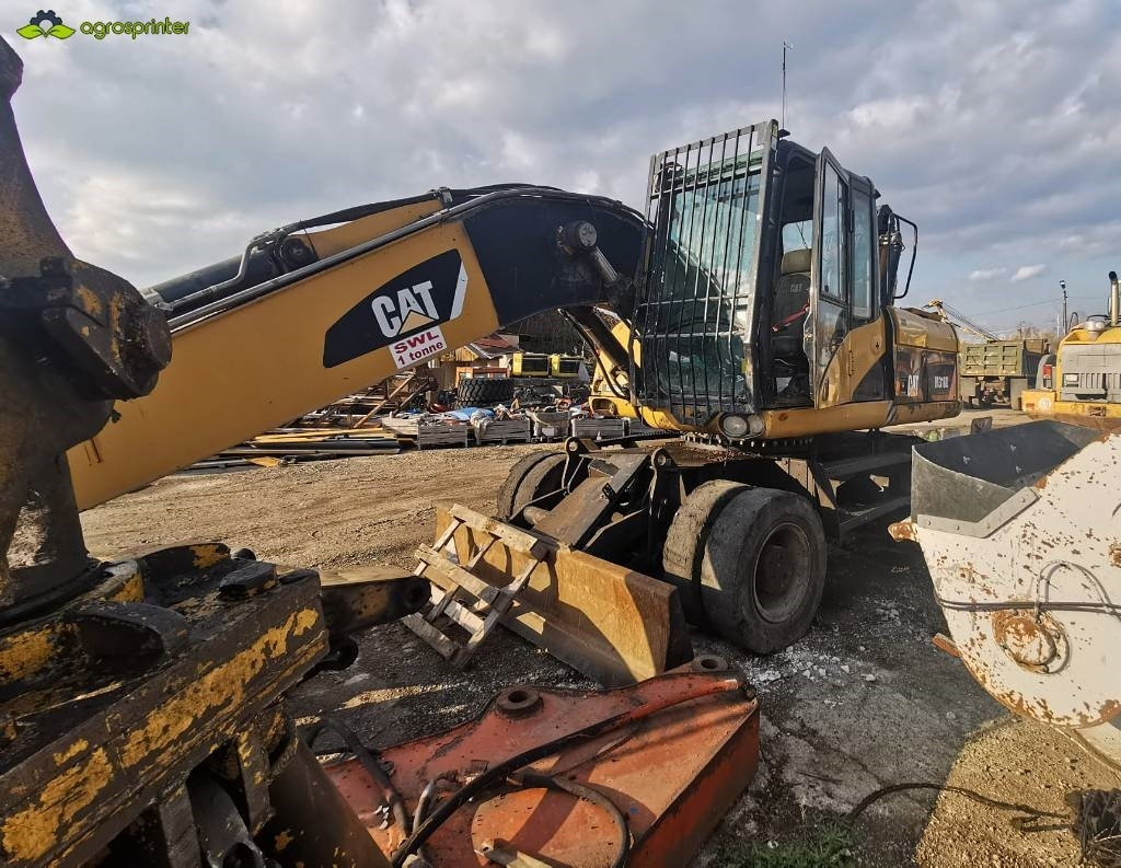 CAT M 318 D - 폐기물/ 산업 처리기 : 사진 2 CAT M 318 D - 폐기물/ 산업 처리기 : 사진 2