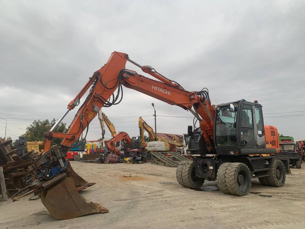 Hitachi ZX 145 W-3+SMP Rototilt  - 휠 굴삭기 : 사진 1 Hitachi ZX 145 W-3+SMP Rototilt  - 휠 굴삭기 : 사진 1