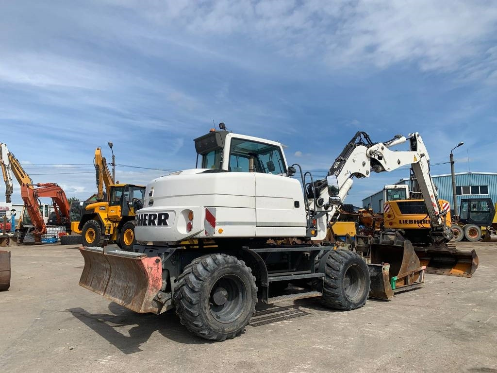 Liebherr A 311 Litronic - 휠 굴삭기 : 사진 4 Liebherr A 311 Litronic - 휠 굴삭기 : 사진 4