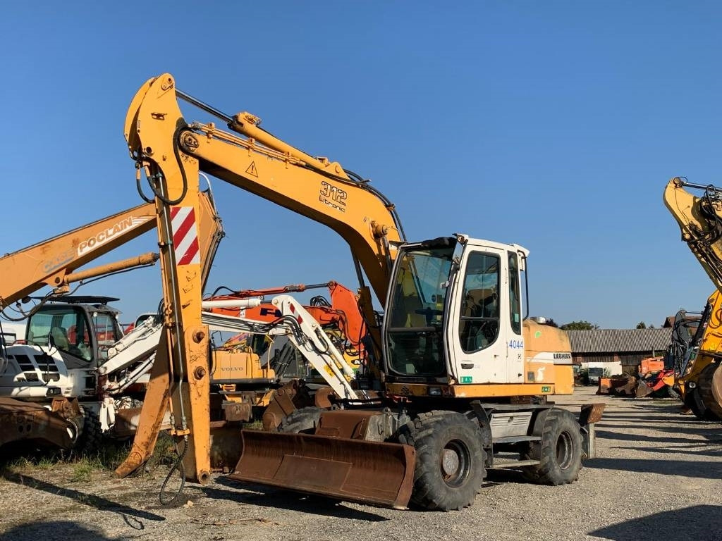 Liebherr A 312 - 휠 굴삭기 : 사진 1 Liebherr A 312 - 휠 굴삭기 : 사진 1
