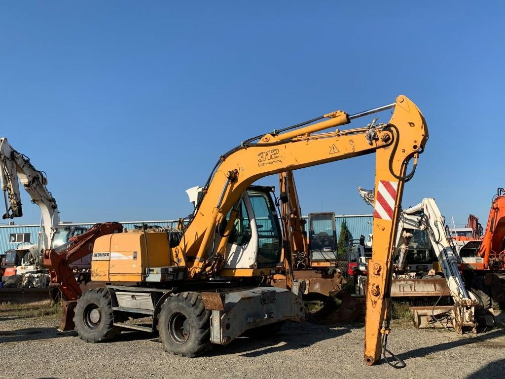Liebherr A 312 - 휠 굴삭기 : 사진 5 Liebherr A 312 - 휠 굴삭기 : 사진 5