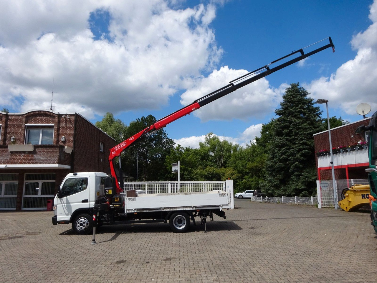 FUSO Canter 7C15 mit FASSI F65A Kran - 플랫베드 밴 : 사진 4 FUSO Canter 7C15 mit FASSI F65A Kran - 플랫베드 밴 : 사진 4