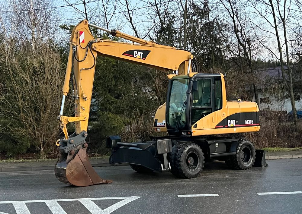 Caterpillar CAT M315C CATERPILLAR SPROWADZONY Bardzo Dobry Stan - 휠 굴삭기 : 사진 1 Caterpillar CAT M315C CATERPILLAR SPROWADZONY Bardzo Dobry Stan - 휠 굴삭기 : 사진 1