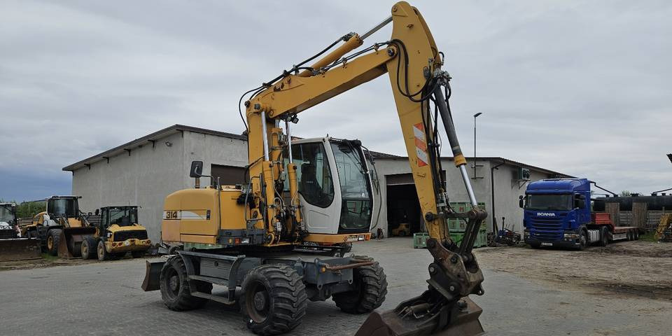 Koparka kołowa Liebherr A314 Litronic 9350 h 4 łyżki kołówka - 휠 굴삭기 : 사진 4 Koparka kołowa Liebherr A314 Litronic 9350 h 4 łyżki kołówka - 휠 굴삭기 : 사진 4