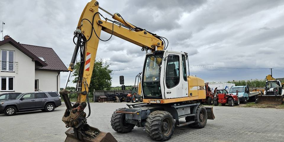 Koparka kołowa Liebherr A314 Litronic 9350 h 4 łyżki kołówka - 휠 굴삭기 : 사진 2 Koparka kołowa Liebherr A314 Litronic 9350 h 4 łyżki kołówka - 휠 굴삭기 : 사진 2