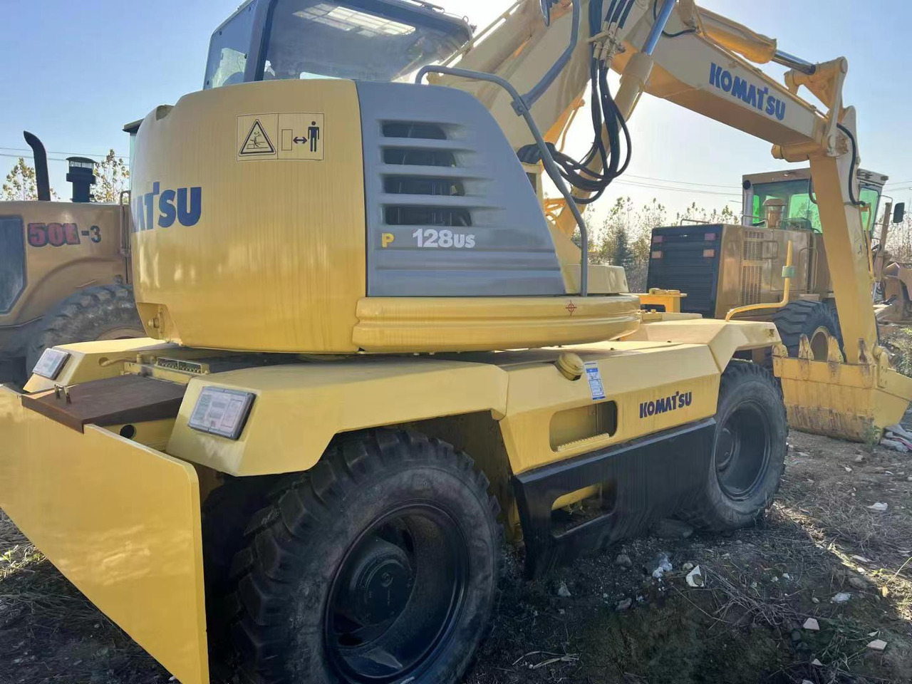 KOMATSU PC128US - 휠 굴삭기 : 사진 2 KOMATSU PC128US - 휠 굴삭기 : 사진 2