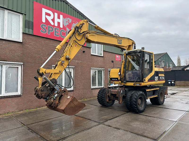 Caterpillar M315 +ROTO CE - 휠 굴삭기 : 사진 2 Caterpillar M315 +ROTO CE - 휠 굴삭기 : 사진 2