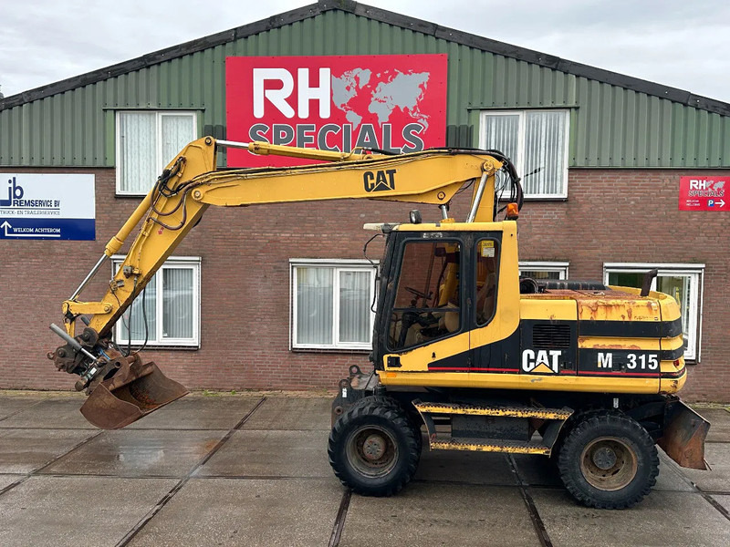 Caterpillar M315 +ROTO CE - 휠 굴삭기 : 사진 1 Caterpillar M315 +ROTO CE - 휠 굴삭기 : 사진 1