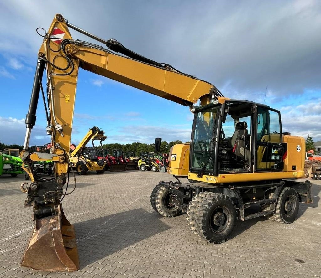 CAT M 318 F - 휠 굴삭기 : 사진 1 CAT M 318 F - 휠 굴삭기 : 사진 1