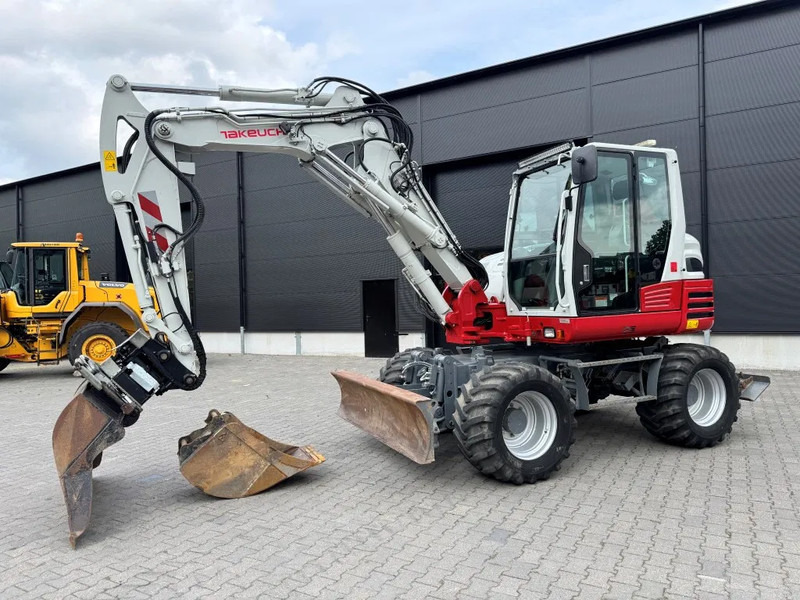 Takeuchi TB295W BJ 2021 3500 uur Compacttilt Draaikantelstuk met Gripper ! - 휠 굴삭기 : 사진 2 Takeuchi TB295W BJ 2021 3500 uur Compacttilt Draaikantelstuk met Gripper ! - 휠 굴삭기 : 사진 2