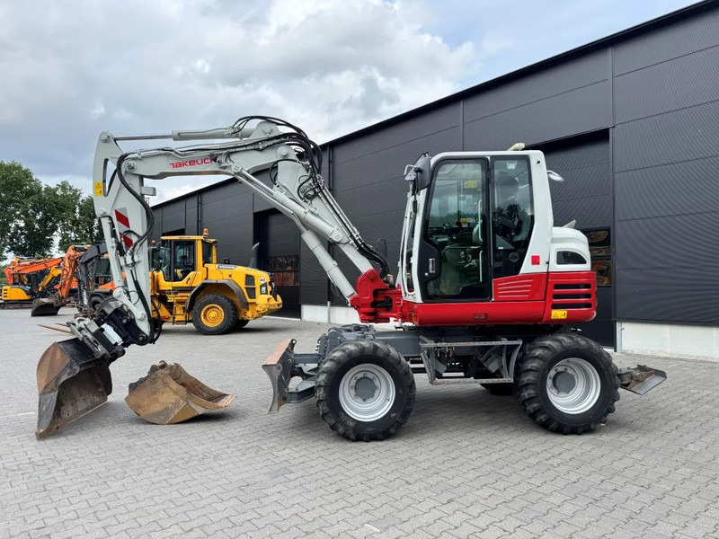 Takeuchi TB295W BJ 2021 3500 uur Compacttilt Draaikantelstuk met Gripper ! - 휠 굴삭기 : 사진 1 Takeuchi TB295W BJ 2021 3500 uur Compacttilt Draaikantelstuk met Gripper ! - 휠 굴삭기 : 사진 1