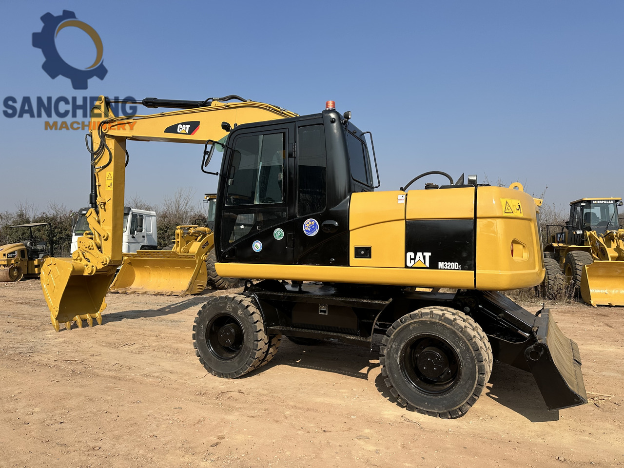 CATERPILLAR M320D2 - 휠 굴삭기 : 사진 1 CATERPILLAR M320D2 - 휠 굴삭기 : 사진 1